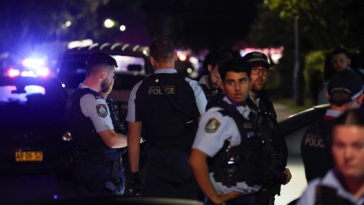 New South Wales police gather outside the Christ the Good Shepherd Church in Sydney's western suburb of Wakeley on April 15, 2024, after several people were stabbed in the church premises. Australian police arrested a man after several people were stabbed at a church in Sydney on April 15 and emergency services said four people were being treated for non-life threatening injuries. (Photo by David GRAY / AFP)