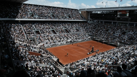 The crowd watch Norway's Casper Ruud playing Spain's Rafael Nadal on the court Philippe Chatrier, known as center court, during their final match of the French Open tennis tournament at the Roland Garros stadium Sunday, June 5, 2022 in Paris. The Roland Garros stadium will host the tennis competitions during the Paris 2024 Olympic Games. (AP Photo/Thibault Camus, File)