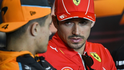 McLaren's British driver Lando Norris (L) and Ferrari's Monegasque driver Charles Leclerc (R) attend a press conference at the Shanghai International circuit ahead of the Formula One Chinese Grand Prix in Shanghai on April 18, 2024. (Photo by Hector RETAMAL / AFP)