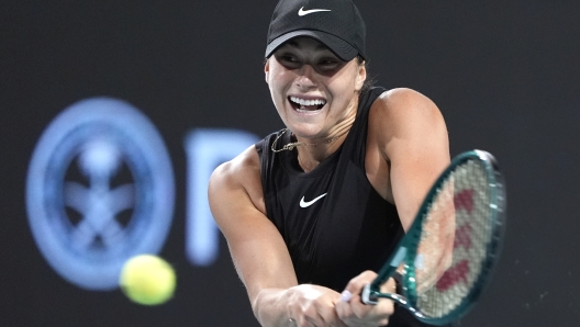 Aryna Sabalenka, of Belarus, hits a return to Anhelina Kalinina, of Ukraine, during the Miami Open tennis tournament Saturday, March 23, 2024, in Miami Gardens, Fla. (AP Photo/Lynne Sladky)