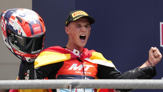 Sergio Garcia, of Spain, celebrates after his win in the Moto2 motorcycle race at Circuit of the Americas, Sunday, April 14, 2023, in Austin, Texas. (AP Photo/Eric Gay)