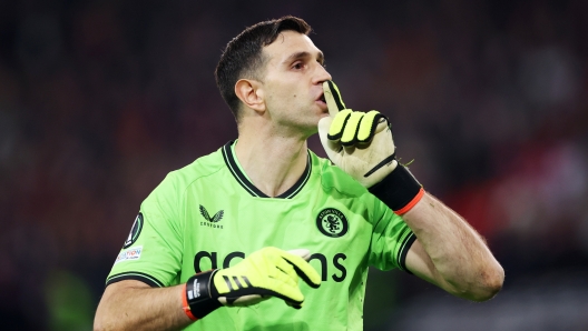 LILLE, FRANCE - APRIL 18: Emiliano Martinez of Aston Villa reacts after saving the first penalty by Nabil Bentaleb of Lille OSC (not pictured) in the penalty shoot out during the UEFA Europa Conference League 2023/24 Quarter-final second leg match between Lille OSC and Aston Villa at Stade Pierre-Mauroy on April 18, 2024 in Lille, France. (Photo by Alex Pantling/Getty Images)