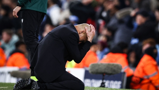 TOPSHOT - Manchester City's Spanish manager Pep Guardiola reacts following a missed chance during the UEFA Champions League quarter-final second-leg football match between Manchester City and Real Madrid, at the Etihad Stadium, in Manchester, north-west England, on April 17, 2024. (Photo by Darren Staples / AFP)