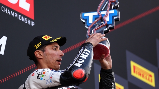 ASSEN, NETHERLANDS - APRIL 21: Toprak Razgatlioglu of Turkey riding a BMW M1000RR for team Germany ROKiT BMW Motorrad WorldSBK Team celebrates victory on the podium after he competes in the WorldSBK or Superbike World Championship, Race 2 held at TT Circuit Assen on April 21, 2024 in Assen, Netherlands. (Photo by Dean Mouhtaropoulos/Getty Images)