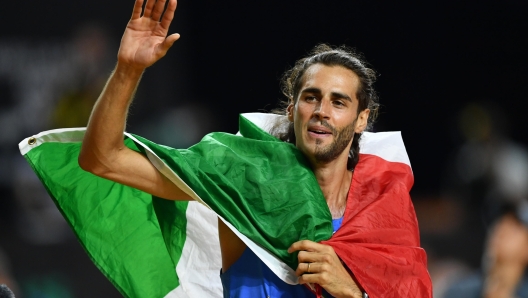 epa10814518 Gianmarco Tamberi of Italy celebrates after winning the Men's High Jump final at the World Athletics Championships Budapest, Hungary, 22 August 2023.  EPA/Adam Warzawa  POLAND OUT