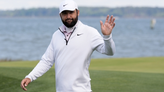 Scottie Scheffler waves after winning the weather delayed RBC Heritage golf tournament, Monday, April 22, 2024, in Hilton Head Island, S.C. (AP Photo/Chris Carlson)