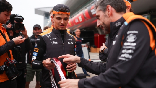 SHANGHAI, CHINA - APRIL 21: Second placed Lando Norris of Great Britain and McLaren, Oscar Piastri of Australia and McLaren and McLaren Team Principal Andrea Stella talk in the pitlane after the F1 Grand Prix of China at Shanghai International Circuit on April 21, 2024 in Shanghai, China. (Photo by Clive Mason - Formula 1/Formula 1 via Getty Images)