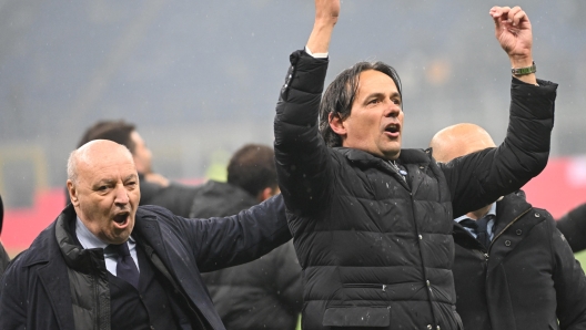 Inter's coach Simone Inzaghi (R) and CEO Giuseppe Marotta celebrate at the end of the Italian Serie A soccer match between Ac Milan and Inter Milan at the Giuseppe Meazza stadium in Milan, Italy, 22 April 2024. ANSA/DANIEL DAL ZENNARO