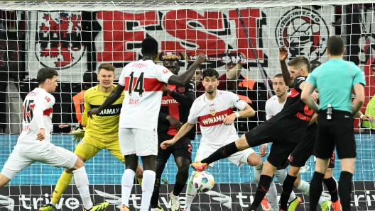 Bayer Leverkusen's German midfielder #08 Robert Andrich (2nd R) scores the 2-2 goal  during the German first division Bundesliga football match Bayer 04 Leverkusen v VfL Stuttgart in Leverkusen, western Germany, on April 27, 2024. (Photo by INA FASSBENDER / AFP) / DFL REGULATIONS PROHIBIT ANY USE OF PHOTOGRAPHS AS IMAGE SEQUENCES AND/OR QUASI-VIDEO