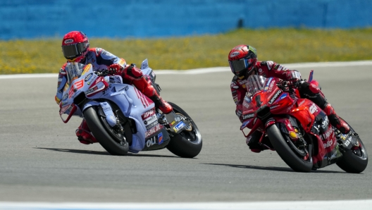 Spain's rider Marc Marquez of the Gresini Racing MotoGP, left, steers his motorcycle followed by Italian rider Francesco Bagnaia of the Ducati Lenovo Team during the MotoGP race of the Spanish Motorcycle Grand Prix at the Angel Nieto racetrack in Jerez de la Frontera, Spain, Sunday, April 28, 2024. (AP Photo/Jose Breton)