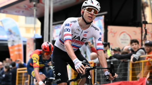 UAE Team Emirates' Slovenian rider Tadej Pogacar reacts after the 115th Milan-SanRemo one-day classic cycling race, between Pavia and SanRemo, on March 16, 2024. (Photo by Marco BERTORELLO / AFP)