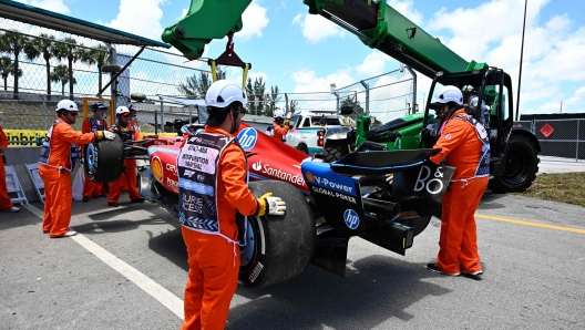 Track workers remove the car of Ferrari's Monegasque driver Charles Leclerc after he spun out during the practice session for the 2024 Miami Formula One Grand Prix at Miami International Autodrome in Miami Gardens, Florida, on May 3, 2024. (Photo by Giorgio Viera / AFP)