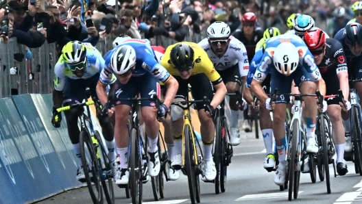 Belgian rider Tim Merlier (2-,L) of Soudal Quick-Step to cross the finish line and win the 3th stage of the 107 Giro d'Italia 2024, cycling race over 166 km from Novara to Fossano, Italy, 06 May 2024. ANSA/LUCA ZENNARO