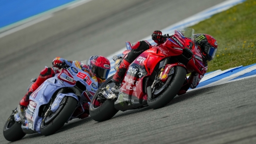 Italian rider Francesco Bagnaia of the Ducati Lenovo Team steers his motorcycle followed by Spain's rider Marc Marquez of the Gresini Racing MotoGP during the MotoGP race of the Spanish Motorcycle Grand Prix at the Angel Nieto racetrack in Jerez de la Frontera, Spain, Sunday, April 28, 2024. (AP Photo/Jose Breton)