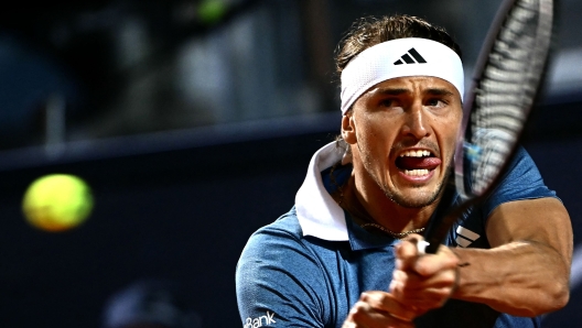 Germany's Alexander Zverev returns the ball to Italy's Luciano Darderi during Men's ATP Rome Open tennis tournament at the Foro Italico in Rome on May 12, 2024. (Photo by Filippo MONTEFORTE / AFP)