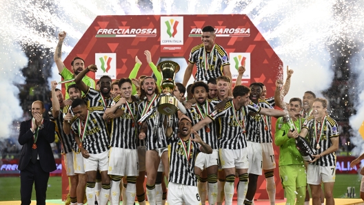 ROME, ITALY - MAY 15: Danilo of Juventus and his teammates celebrate the winning of the Italian Cup and raising the trophy after the Coppa Italia final match between Atalanta BC and Juventus FC at Olimpico Stadium on May 15, 2024 in Rome, Italy. (Photo by Daniele Badolato - Juventus FC/Juventus FC via Getty Images)