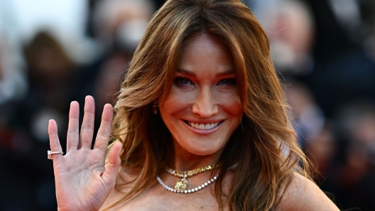 French-Italian model and musician Carla Bruni arrives for the screening of the film "Emilia Perez" at the 77th edition of the Cannes Film Festival in Cannes, southern France, on May 18, 2024. (Photo by LOIC VENANCE / AFP)