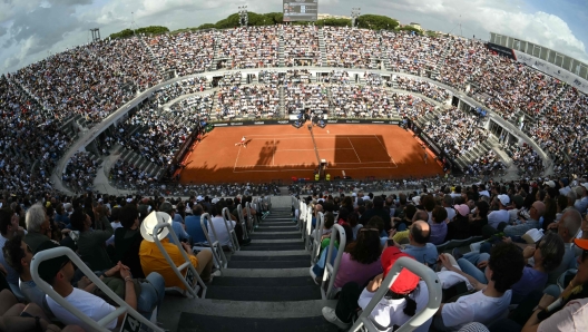 Chile's Nicolas Jarry (L) serves to Germany's Alexander Zverev during the final of the Men's ATP Rome Open tennis tournament at Foro Italico in Rome on May 19, 2024. (Photo by Andreas SOLARO / AFP)