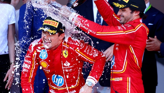 MONTE-CARLO, MONACO - MAY 26: Race winner Charles Leclerc of Monaco and Ferrari and Third placed Carlos Sainz of Spain and Ferrari celebrate on the podium during the F1 Grand Prix of Monaco at Circuit de Monaco on May 26, 2024 in Monte-Carlo, Monaco. (Photo by Clive Rose/Getty Images)