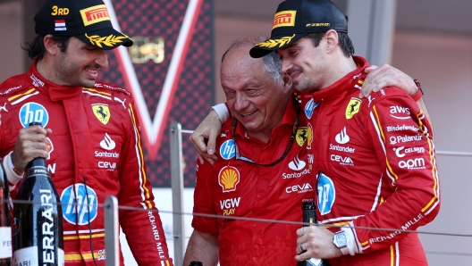 MONTE-CARLO, MONACO - MAY 26: Race winner Charles Leclerc of Monaco and Ferrari, Third placed Carlos Sainz of Spain and Ferrari and Ferrari Team Principal Frederic Vasseur celebrate on the podium during the F1 Grand Prix of Monaco at Circuit de Monaco on May 26, 2024 in Monte-Carlo, Monaco. (Photo by Ryan Pierse/Getty Images)