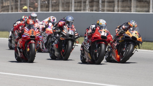 BARCELONA, SPAIN - MAY 26: Brad Binder of South Africa and Red Bull KTM Factory Racing leads the field during the MotoGp race during the MotoGP Of Catalunya - Race  at Circuit de Barcelona-Catalunya on May 26, 2024 in Barcelona, Spain. (Photo by Mirco Lazzari gp/Getty Images)