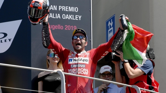 Italian Moto GP rider Danilo Petrucci of Ducati Team celebrates on the podium after winning  the Motorcycling Grand Prix of Italy at the Mugello circuit in Scarperia, central Italy, 2 June 2019
ANSA/CLAUDIO GIOVANNINI