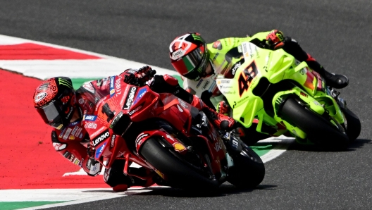 Ducati Italian rider Francesco Bagnaia and Ducati Italian rider Fabio Di Giannantonio (R) ride during a practice session ahead of the Italian MotoGP race at Mugello on May 31, 2024. (Photo by Marco BERTORELLO / AFP)