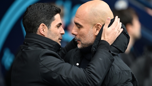 MANCHESTER, ENGLAND - MARCH 31: Mikel Arteta, Manager of Arsenal, interacts with Pep Guardiola, Manager of Manchester City, prior to the Premier League match between Manchester City and Arsenal FC at Etihad Stadium on March 31, 2024 in Manchester, England. (Photo by Michael Regan/Getty Images) (Photo by Michael Regan/Getty Images)