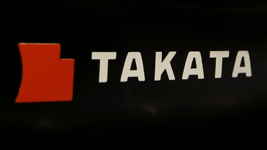 FILE - The logo of Takata Corp. is displayed at an auto supply shop in Tokyo, July 6, 2016. In a document posted Tuesday, Aug. 1, 2023, General Motors announced it is recalling nearly 900 vehicles in the U.S. and Canada with Takata air bag inflators that could explode and hurl shrapnel in a crash. (AP Photo/Shizuo Kambayashi, File)