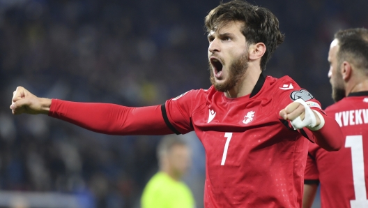 FILE - Georgia's Khvicha Kvaratskhelia, right, celebrates after scoring his side's second goal during the Euro 2024 group A qualifying soccer match between Georgia and Scotland at the Boris Paichadze National Stadium in Tbilisi, Georgia, on Nov. 16, 2023. (AP Photo/Tamuna Kulumbegashvili, File)