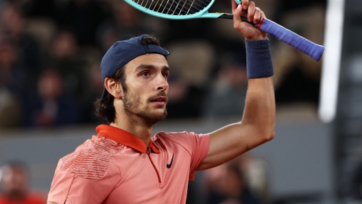 Italy's Lorenzo Musetti celebrates after a point as he plays against Serbia's Novak Djokovic during their men's singles match on Court Philippe-Chatrier on day seven of the French Open tennis tournament at the Roland Garros Complex in Paris on June 2, 2024. (Photo by EMMANUEL DUNAND / AFP)