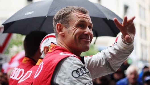 LE MANS, FRANCE - JUNE 15:  Tom Kristensen of Denmark and Audi Sport E-Tron Quattro attends the drivers parade during previews for the Le Mans 24 Hour race on June 15, 2012 in Le Mans, France.  (Photo by Ker Robertson/Getty Images)