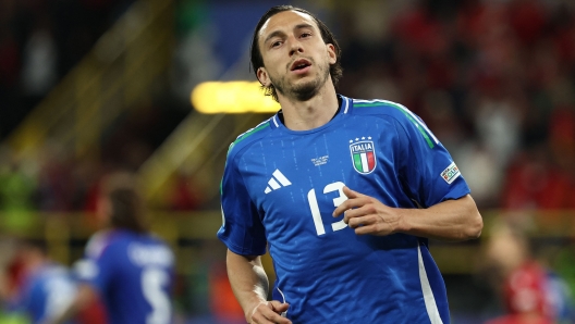 Italy's defender #13 Matteo Darmian celebrates after winning the UEFA Euro 2024 Group B football match between Italy and Albania at the BVB Stadion in Dortmund on June 15, 2024. (Photo by FRANCK FIFE / AFP)