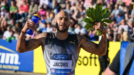 epa11420493 First place Lamont Marcell Jacobs of Italy celebrates after the Men 100m final event at the Paavo Nurmi Games as part of the 2024 World Athletics Continental Tour Gold in Turku, Finland, 18 June 2024.  EPA/Kimmo Brandt