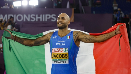 Gold medalist Marcell Jacobs of Italy celebrates after the 100m Men Final during the European Athletics Championship at Olimpico Stadium in Rome, Italy, 08 June 2024. ANSA/FABIO FRUSTACI