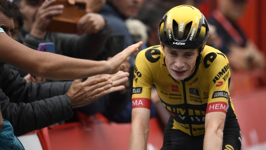 (FILES) Team Jumbo-Visma's Danish rider Jonas Vingegaard crosses the finish line in first place during the stage 16 of the 2023 La Vuelta cycling tour of Spain, a 120 km race between Liencres and Bejes on September 12, 2023. Vingegaard breaks collarbone and ribs in Basque crash, AFP reports on April 4, 2024. Two-time Tour de France champion Jonas Vingegaard was "conscious" after being taken to hospital following a mass crash in stage four of the Tour of the Basque Country race, his team said. (Photo by MIGUEL RIOPA / AFP)