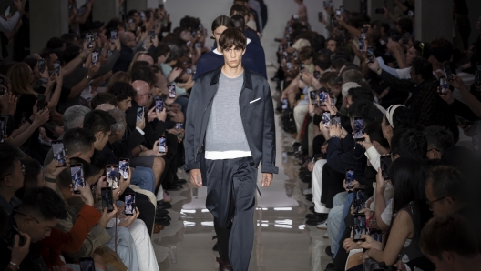 MILAN, ITALY - JUNE 15: Models walk finale of the runway at the Neil Barrett fashion show during the Milan Menswear Spring/Summer 2025 on June 15, 2024 in Milan, Italy. (Photo by Justin Shin/Getty Images)