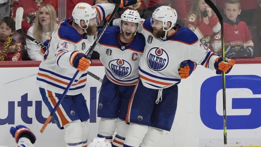 Edmonton Oilers center Connor McDavid (97) celebrates his goal during the third period of Game 5 of the NHL hockey Stanley Cup Finals against the Florida Panthers, Tuesday, June 18, 2024, in Sunrise, Fla. The Oilers defeated the Panthers 5-3. (AP Photo/Rebecca Blackwell)