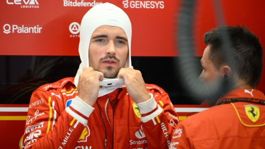 Ferrari's Monegasque driver Charles Leclerc prepares in the stands during the first practice session at the Circuit de Catalunya on June 21, 2024 in Montmelo, on the outskirts of Barcelona, ahead of the Spanish Formula One Grand Prix. (Photo by Josep LAGO / AFP)