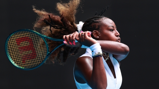 MELBOURNE, AUSTRALIA - JANUARY 19: Alycia Parks of the United States plays a backhand in their round three singles match against Coco Gauff of the United States during the 2024 Australian Open at Melbourne Park on January 19, 2024 in Melbourne, Australia. (Photo by Kelly Defina/Getty Images)