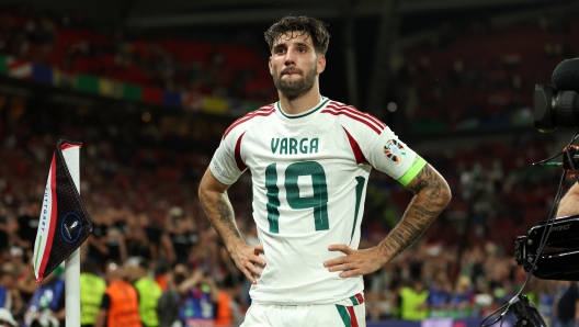 STUTTGART, GERMANY - JUNE 23: Barnabas Varga of Hungary looks on after the team's victory whilst wearing the shirt of teammate Barnabas Varga (not pictured), who left the field following an injury, during the UEFA EURO 2024 group stage match between Scotland and Hungary at Stuttgart Arena on June 23, 2024 in Stuttgart, Germany. (Photo by Carl Recine/Getty Images)