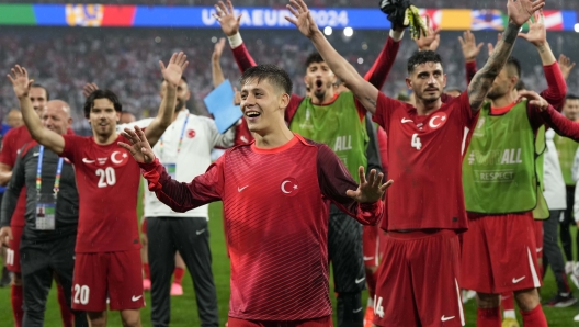 Turkey's Arda Guler, center, celebrates with team mates after a Group F match between Turkey and Georgia at the Euro 2024 soccer tournament in Dortmund, Germany, Tuesday, June 18, 2024. (AP Photo/Martin Meissner)