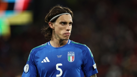 Italy's defender #05 Riccardo Calafiori looks on during the UEFA Euro 2024 Group B football match between Italy and Albania at the BVB Stadion in Dortmund on June 15, 2024. (Photo by FRANCK FIFE / AFP)