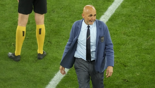 Italy's head coach Luciano Spalletti walks on the pitch at the end of a Group B match between Italy and Albania at the Euro 2024 soccer tournament in Dortmund, Germany, Saturday, June 15, 2024. (AP Photo/Andreea Alexandru)