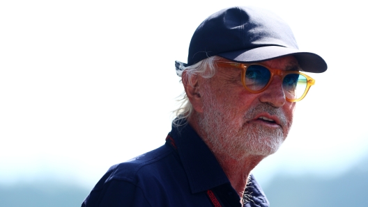 SPIELBERG, AUSTRIA - JUNE 29: Flavio Briatore, Executive Advisor to Alpine F1,  looks on in the Paddock prior to the Sprint ahead of the F1 Grand Prix of Austria at Red Bull Ring on June 29, 2024 in Spielberg, Austria. (Photo by Clive Rose/Getty Images)