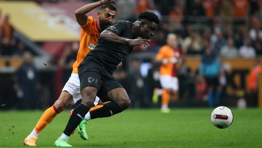 ISTANBUL, TURKEY - April 2: Fisayo Dele-Bashiru of Hatayspor is challenged by Kerem Demirbay of Galatasaray during the Turkish Super League match between Galatasaray and Hatayspor Rams Park on April 2, 2024 in Istanbul, Turkey. (Photo by Ahmad Mora/Getty Images)