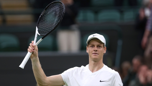 LONDON, ENGLAND - JULY 01: Jannick Sinner of Italy celebrates winning match point against Yannick Hanfmann of Germany in the Gentlemen's Singles first round match during day one of The Championships Wimbledon 2024 at All England Lawn Tennis and Croquet Club on July 01, 2024 in London, England. (Photo by Julian Finney/Getty Images)