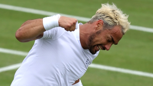 LONDON, ENGLAND - JULY 03: Fabio Fognini of Italy celebrates winning match point against Casper Ruud of Norway in his Men's Singles second round match during day three of The Championships Wimbledon 2024 at All England Lawn Tennis and Croquet Club on July 03, 2024 in London, England. (Photo by Clive Brunskill/Getty Images)