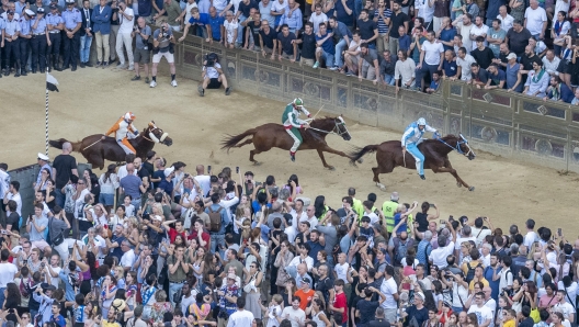 Jockey Carlo Sanna, also known as Brigante, on horse Tabacco in action before winning the historical horse race 'Palio di Siena' has been postponed to 3 July due to the rain the historical horse race 'Palio di Siena' in Siena, Italy, 04 July 2024. The traditional horse races between the Siena city districts will be held 02 July as the 'Palio di Provenzano' on the holiday of the Madonna of Provenzano and on 16 August as the 'Palio dell'Assunta' on the holiday of the Virgin Mary. ANSA/CLAUDIO GIOVANNINI