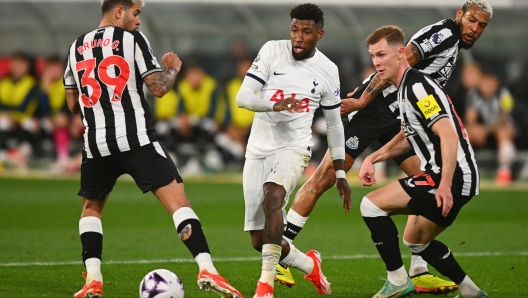 MELBOURNE, AUSTRALIA - MAY 22: Emerson Royal of Tottenham Hotspur passes the ball during the exhibition match between Tottenham Hotspur FC and Newcastle United FC at Melbourne Cricket Ground on May 22, 2024 in Melbourne, Australia. (Photo by Morgan Hancock/Getty Images)